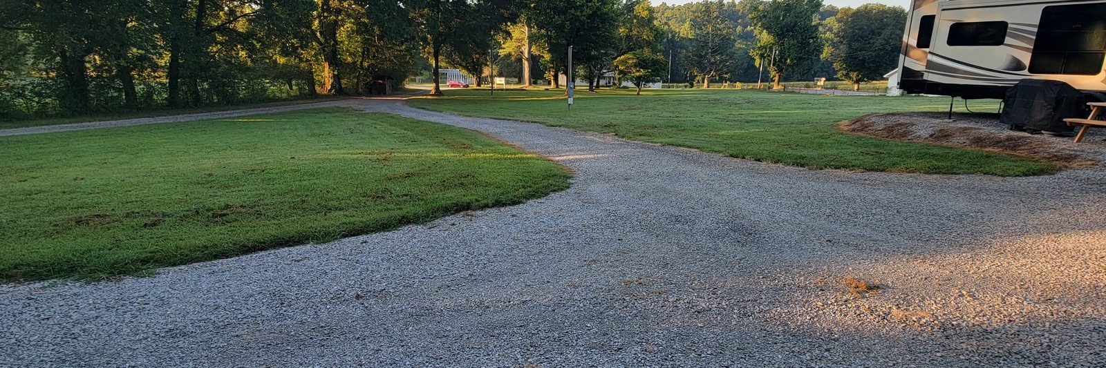 An open level gravel site at Gryptid RV Park ready for the next guest