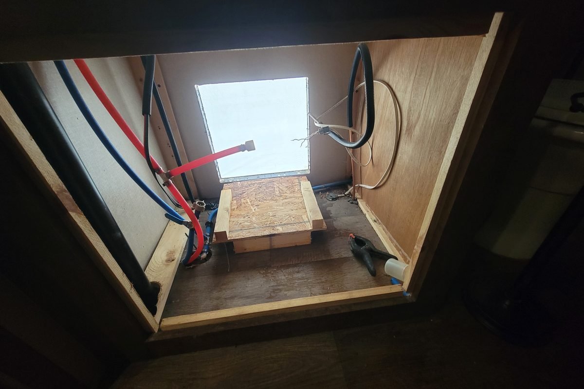 Inside the utility cabinet showing the network equipment and wiring