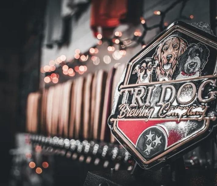 The Tri Dog Brewing Company sign above the taps in the Harriman taproom